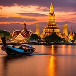 Sunset view of Wat Arun temple and Chao Phraya River in Bangkok
